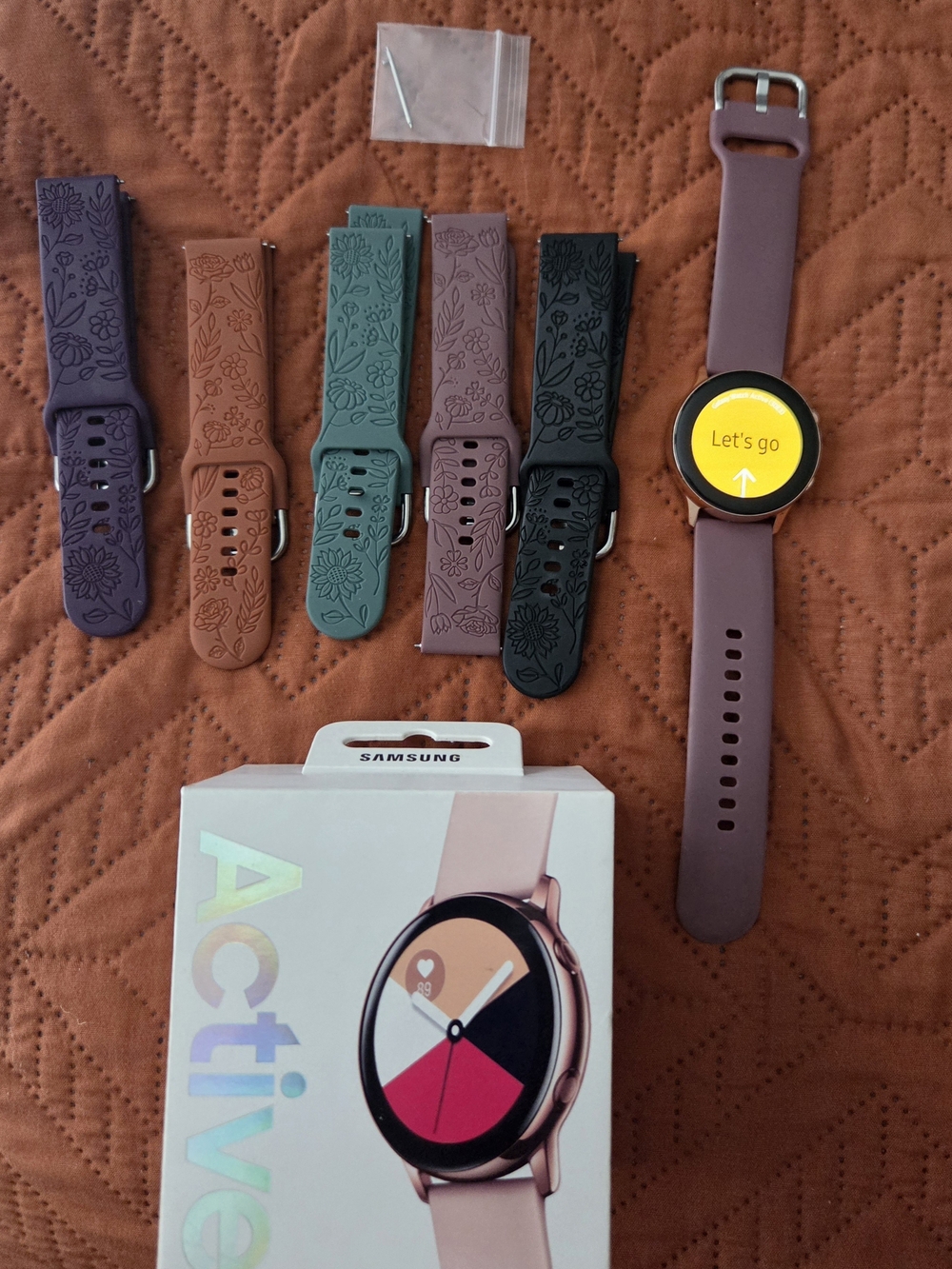 Samsung Galaxy Active Smartwatch with Plum and Multi-Color Silicone Bands